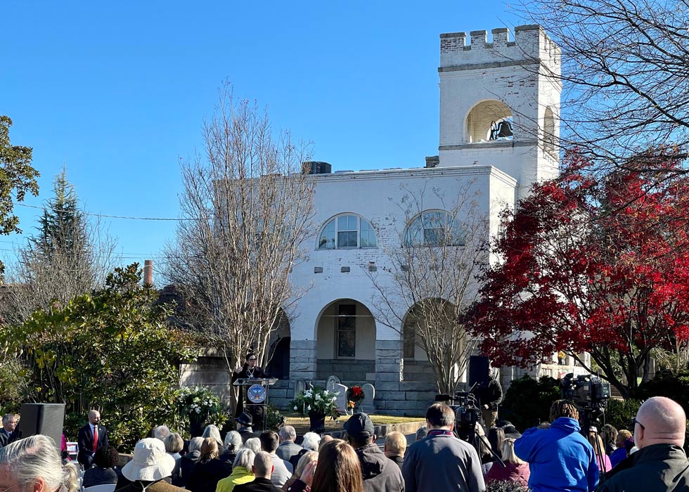 A crowd gathers at Oakland Cemetery's Bell Tower for a groundbreaking ceremony.